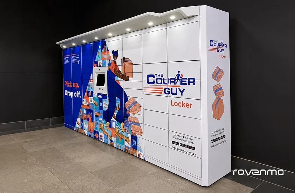 A Rovlocker R7 in The Courier Guy livery against a dark wall, its canopy lights on